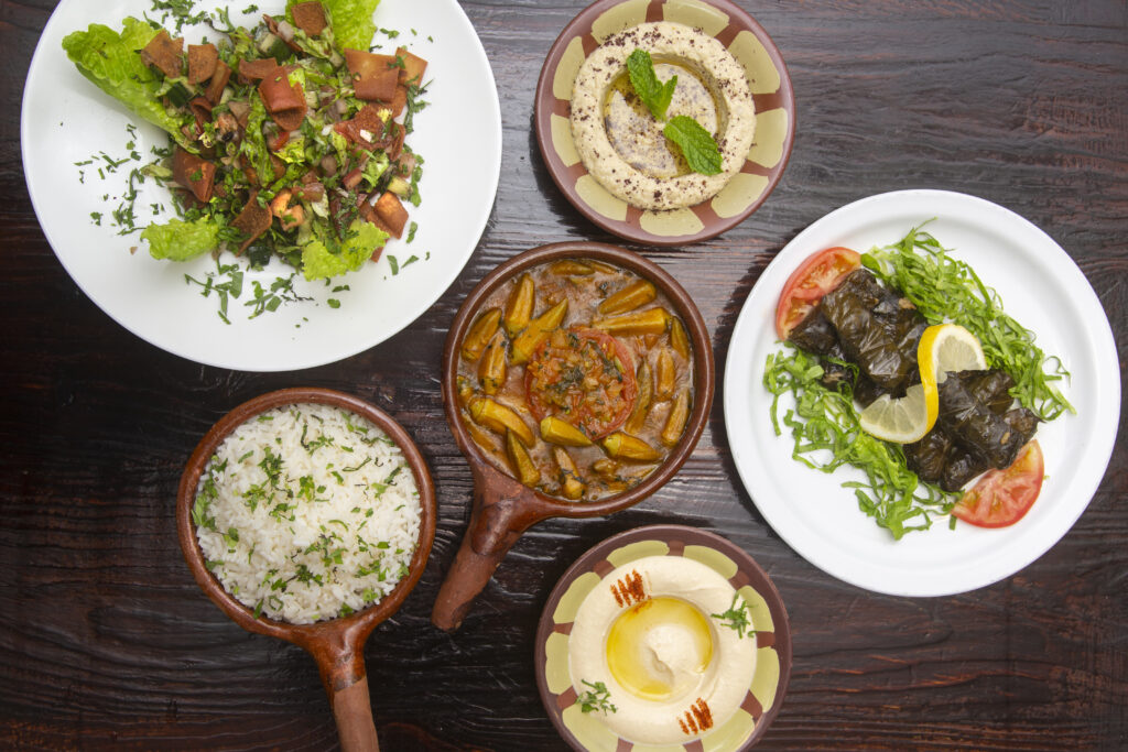 table with typical lebanese food dishes warak enab ocra